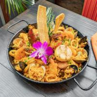 Paella · Saffron rice, clams, mussels, calamari, bay scallops, lobster and chorizo garnished with roa...