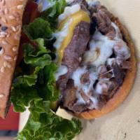 Ribeye Burger · Delicious Single meat Burger prepared with Ground Beef And Extra Ribeye Meat With Shredded C...