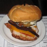 Bacon BBQ Burger  · A 6 oz. fresh ground beef patty smothered with cheddar cheese, bacon, honey BBQ sauce and to...
