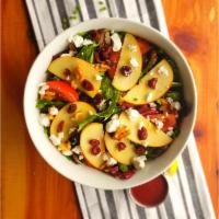 Fuji Salad · Arugula spring mix, tomato, fresh-cut apples, walnuts, cranberries, goat cheese, raspberry v...
