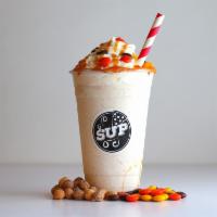 Nutty Butter Shake · Peanut butter, Reese's Pieces, Reese's Puffs, and caramel drizzle.