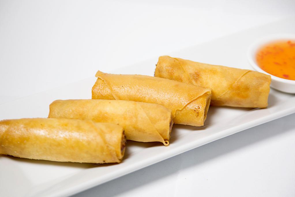 Crispy Spring Roll · Fried spring roll stuffed with vegetables and glass noodles, served with plum sauce.
