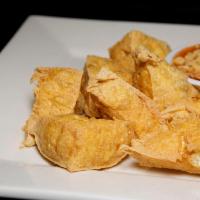 Golden Triangle · Fried tofu served with ground peanut and chili sauce. 