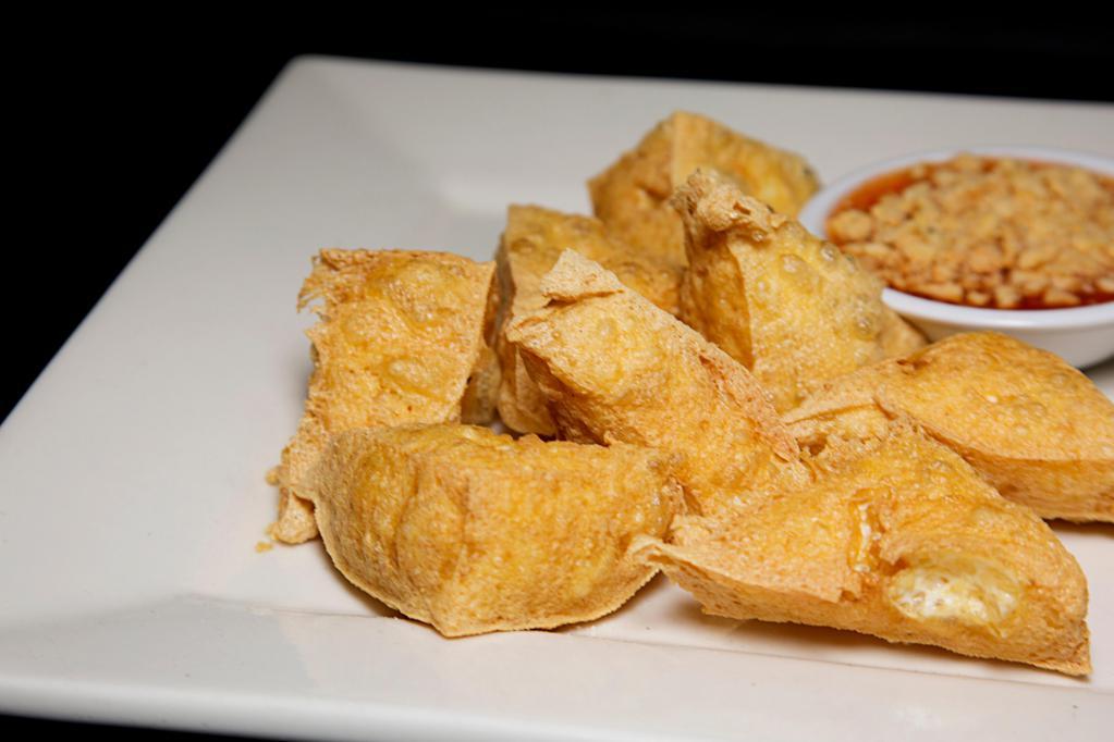 Golden Triangle · Fried tofu served with ground peanut and chili sauce. 