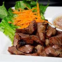 Moo Yang · Grilled marinated pork served with house chili sauce. 