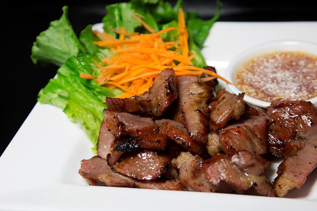 Moo Yang · Grilled marinated pork served with house chili sauce. 