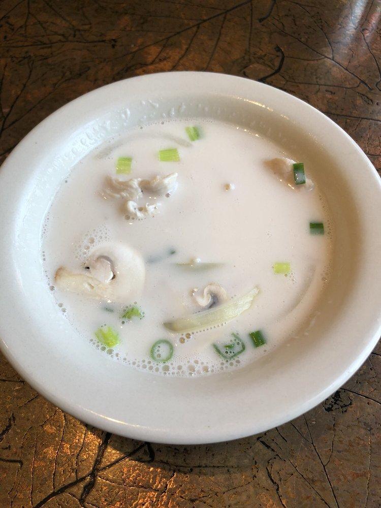 Chicken Tom Kha Soup · Coconut milk soup with chicken, lemon grass, mushroom, onion and galangal root.