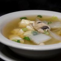 Tofu Soup · Clear broth with soft tofu, mushrooms, onions, and glass noodles. 