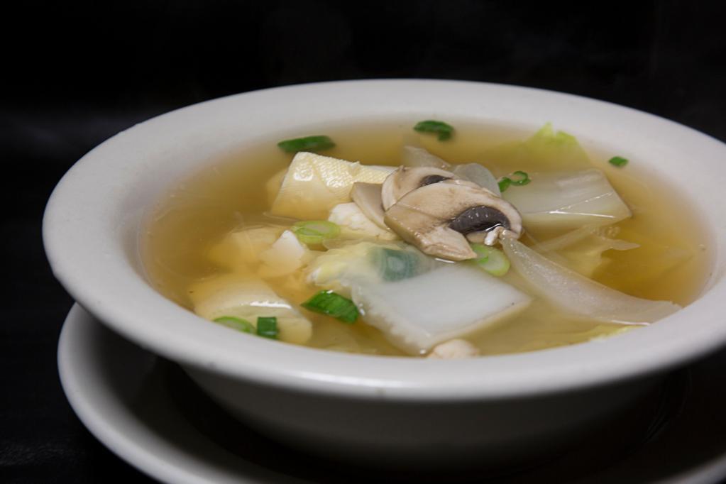 Tofu Soup · Clear broth with soft tofu, mushrooms, onions, and glass noodles. 