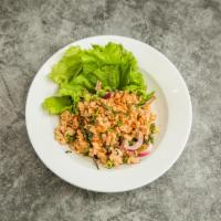 Larb Chicken Salad · Minced chicken salad in lime juice, bell pepper, onion, green vegetables and basil. 