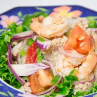 Yum Woon Sen · Glass noodle salad with shrimp, minced chicken and tomato in lime juice.