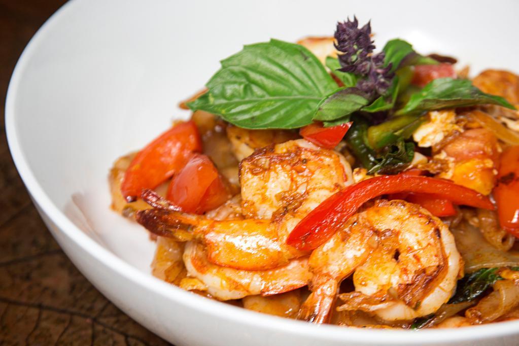 Drunken Noodles · Wide rice noodles sauteed with egg, onion, bell pepper, chili and basil. Hot and spicy. 
