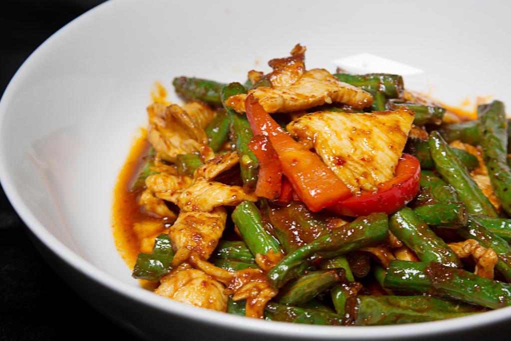 Pad Prig Khing · Choice of meat or vegetable, sauteed with spicy curry paste, string beans, kaffir lime leaves and Thai herbs.