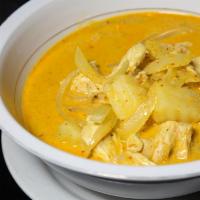 Yellow Curry · Yellow curry in coconut milk, potato, onion and Thai herbs. Mildly Spicy. Served with steame...