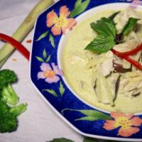 Green Curry · Spicy green curry in coconut milk, bamboo shoot, eggplant and basil. Served with steamed ric...