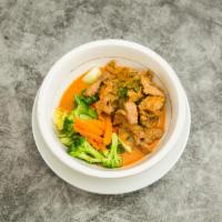 Gang Panang · Panang curry in coconut milk, vegetable, basil and lime leaves. Served with steamed rice. Me...