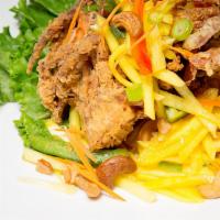 Softshell Crab Mango · 2 deep fried crabs topped with mango salad, served with jasmine rice.