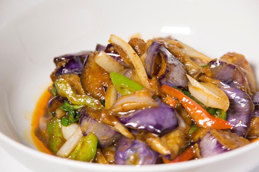 Eggplant Basil · Eggplant sauteed with chili and basil leaves. Served with steamed rice. Hot and spicy. 