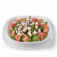 Caprese Salad · Fresh mozzarella, tomatoes, arugula, and balsamic glaze.