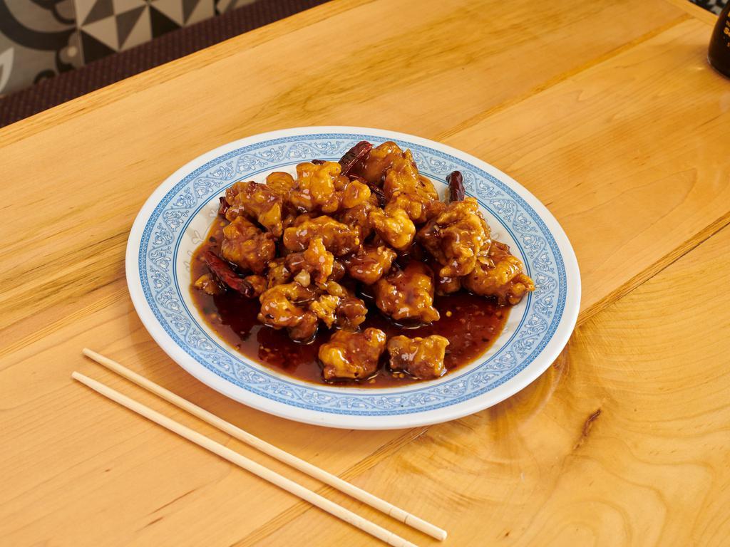 General Tao's Chicken · The chicken dish that over whelmed general Tao glazed, golden brown and tasty sweet brown sauce. Spicy.
