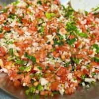 Pico de Gallo · Chopped tomato, onion, avocado, lime juice, and cilantro. Served with tortilla chips.