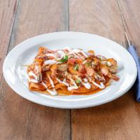 Taco Lime Shrimp · 5 pieces.  Grilled shrimp skewer with red enchilada sauce, and topped with cilantro.