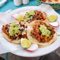 Tacos al Pastor · 3 Tacos with pork, enchilada meat, pineapple, cilantro and onions. 