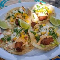Fish Tacos  · Fried fish, mango, cilantro, jalapeño, onion, lemon juice and chipotle sauce. 