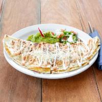 Quesadilla · Flour tortilla with cheese and your choice of meat. Served with guacamole and sour cream.