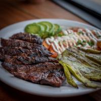 Steak Tampiqueno  · Skirt steak cooked to your liking, 2 enchiladas, nopal and avocado served with rice and bean...