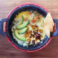 Queso Fundido · Melted manchego cheese, your choice of meat, jalapeño, pico de gallo and avocado. 