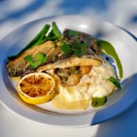Branzino Fillet · Branzino fillet served with mashed potatoes, string beans, capers and white wine salsa. 