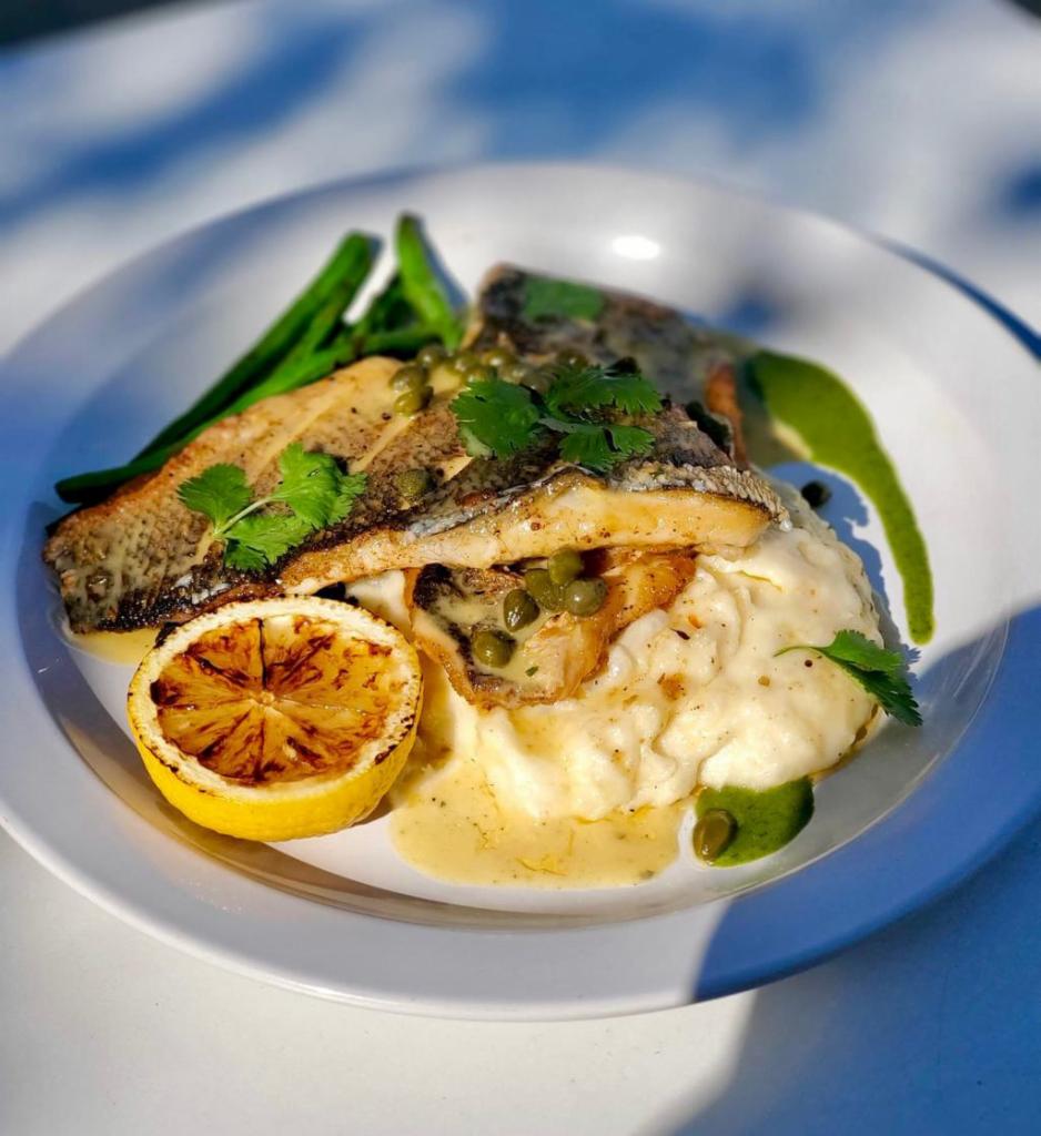 Branzino Fillet · Branzino fillet served with mashed potatoes, string beans, capers and white wine salsa. 