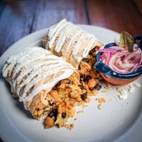 Vegetarian Burrito  · Chickpeas, squash, mexican pumpkin,
corn, black beans and rice. Served with pickled red onio...