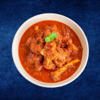 Lamb Tikka Masala · Boneless lamb meat simmered in a thick, tangy tomato and onion masala gravy served with a ri...