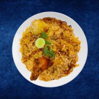 Chicken Deluxe Biryani · Tender chicken morsels cooked in a special biryani masala curry, layered with imported long ...