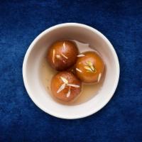 Classic Gulab Jamun  · Village cheese dumplings deep-fried and steeped in a cardamom infused sugar syrup.