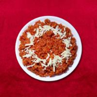 Shredded Carrot Pudding · Shredded carrots grated cooked in a pot with milk, sugar, and cardamom.