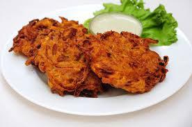 Onion Bhaji · Fried onions and potatoes battered with spices and deep-fried. 