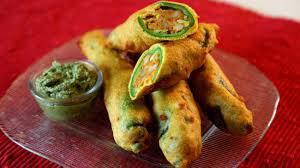 Mirchi Pakoda · Long hot peppers, sliced and filled with a mildly spiced potato mixture. Lightly coated and ...