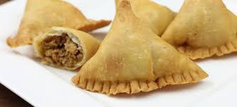 2 Pieces Chicken Samosas · Minced chicken and peas mixed with spices and stuffed in a pastry shell.