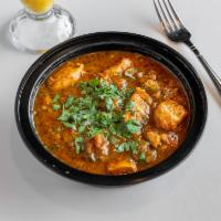 Chicken Curry · Light gravy made with onions and tomatoes and flavored with ginger and garlic.
