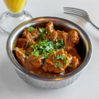 Lamb Curry · Light gravy made with onions and tomatoes and flavored with ginger and garlic.