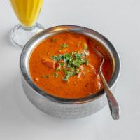 Paneer Tikka Masala · Rich tomatoes and onion sauce cooked with mild spices and topped with light cream.