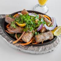 Chicken Seekh Kebab · Minced chicken mixed with hung yogurt and spices cooked on skewers in clay oven served with ...