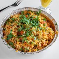 Chicken Biryani · Aromatic basmati rice cooked with marinated chicken, herbs and spices.