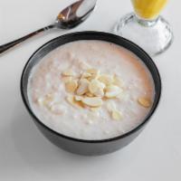 Kheer · Rice pudding flavored with almonds, cashews, golden raisins and cardamom.