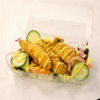 Chicken Tender Salad · Crispy chicken tenders, with onions, tomatoes, olives and cucumbers and choice of dressing.