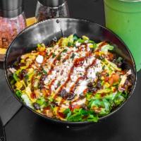 Chipotle BBQ Chicken · Romaine lettuce, chipotle BBQ chicken, black beans, corn, cilantro, tortilla chips, cheddar ...