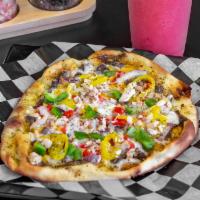 Jamaican Jerk Chicken Flatbread · Naan bread, infused cold pressed olive oil. House-made signature jerk sauce, Monterey Jack a...